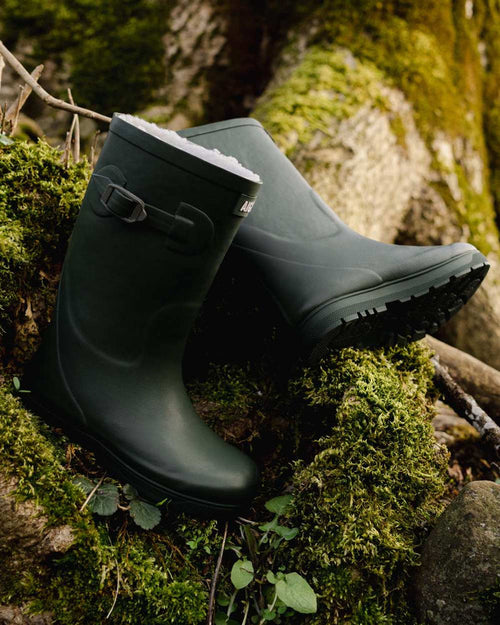 Khaki coloured Aigle Childrens Woody Pop Fur 2 Boots on forest background #colour_khaki