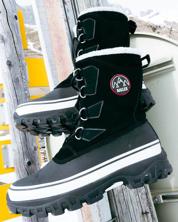 Noir coloured Aigle Mens Snow Boots on outdoor background #colour_noir