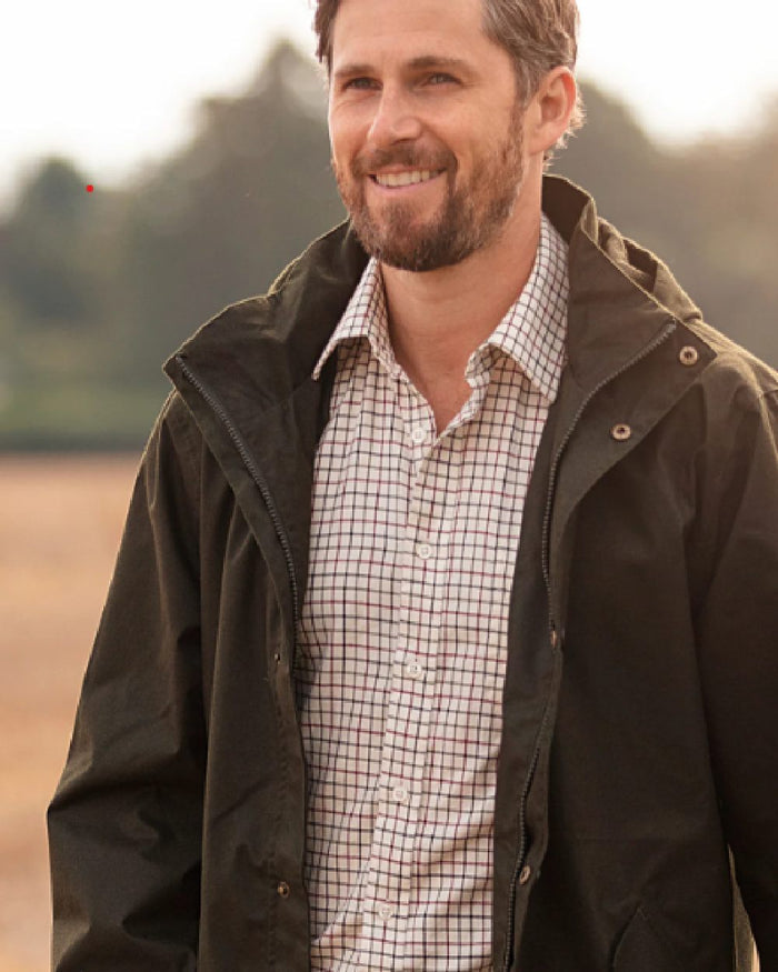 Red coloured Alan Paine Aylesbury Check Shirt on blurry background #colour_red
