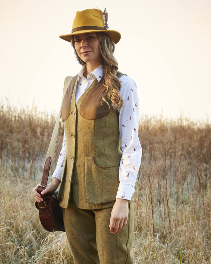 Grove coloured Alan Paine Combrook Ladies Tweed Shooting Waistcoat on field background #colour_grove