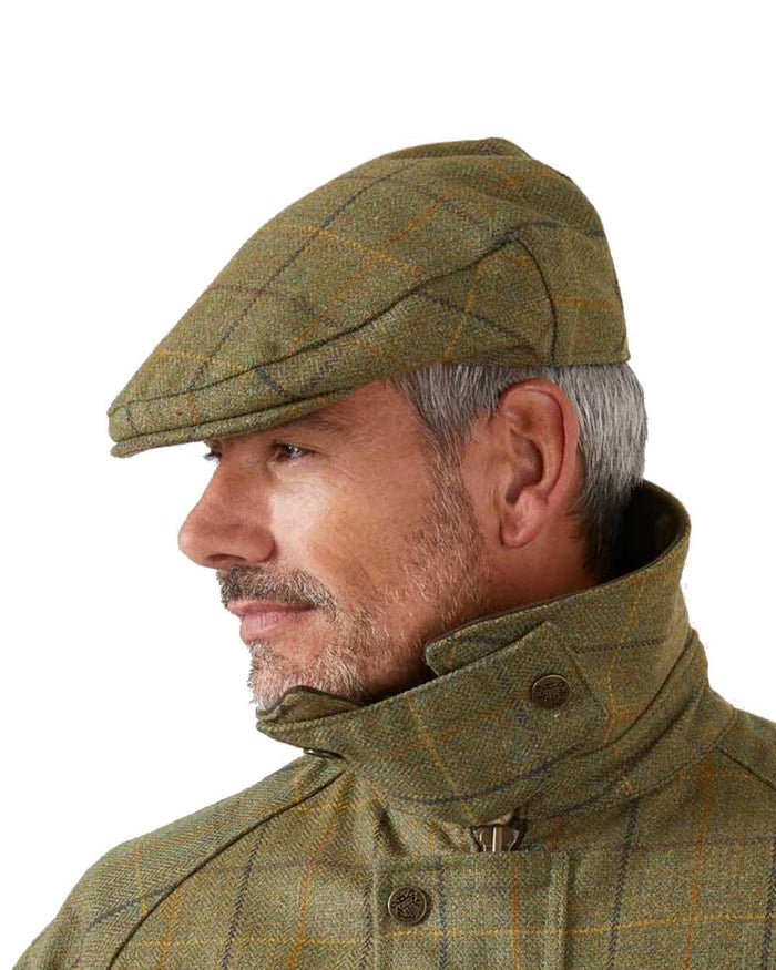 Alan Paine Rutland Waterproof Tweed Flat Cap in Dark Moss #colour_dark-moss