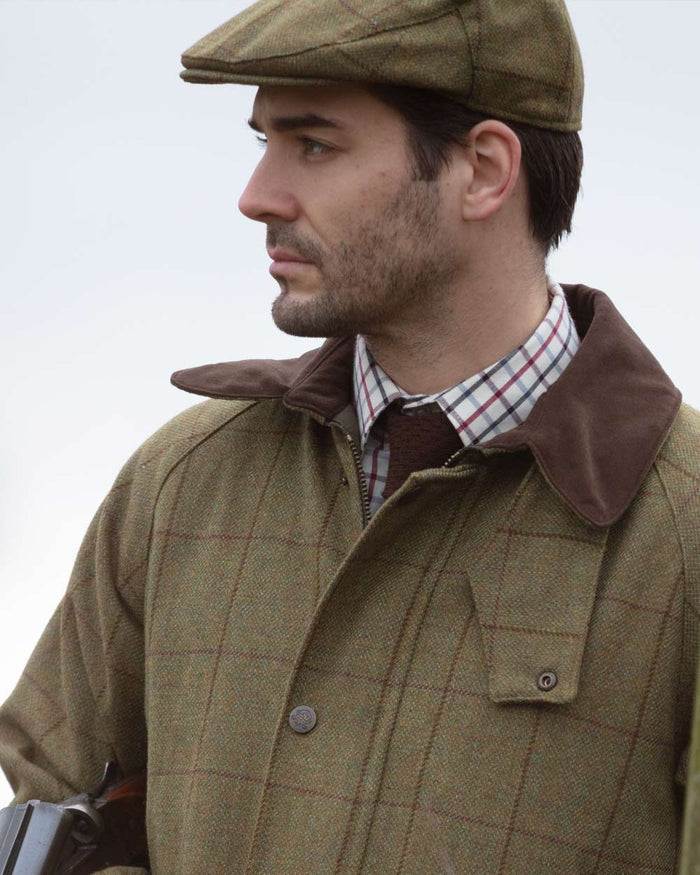 Lichen coloured Alan Paine Rutland Waterproof Tweed Shooting Coat on sky background #colour_lichen
