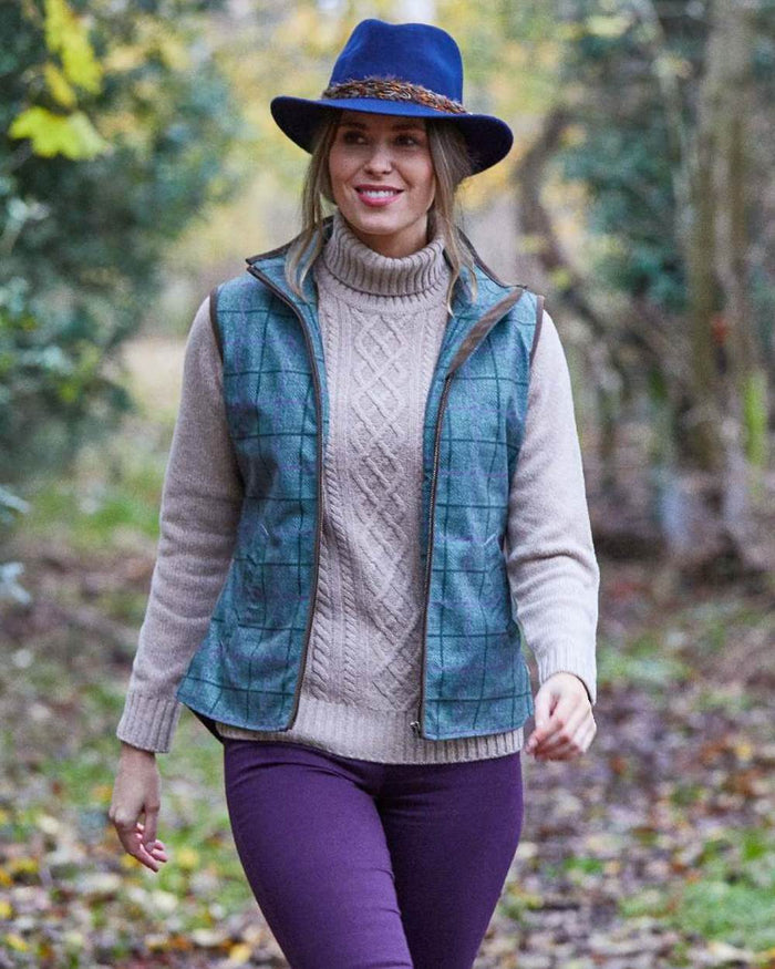 Seagrass coloured Alan Paine Womens Didsmere Gilet on forest background #colour_seagrass
