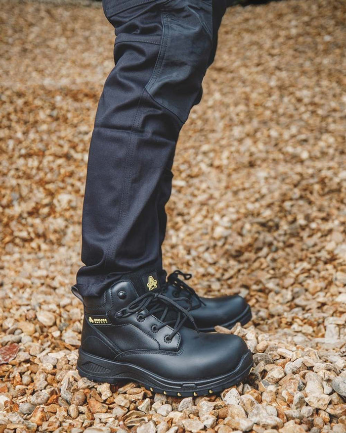 Black Coloured Amblers Safety AS605C Safety Boots on outdoor background #colour_black