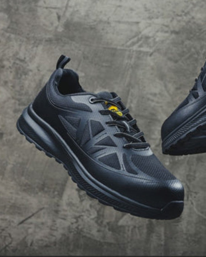 Black Coloured Amblers Safety AS721C Hurdle S1PL Safety Trainers on Stone Background
#colour_black