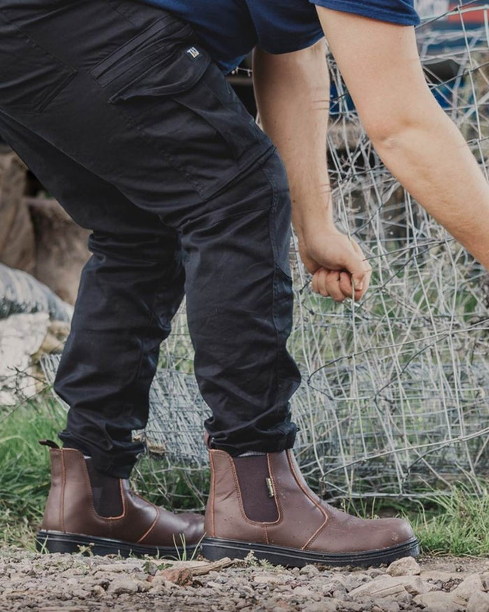 Brown Coloured Amblers Safety FS128 Hardwearing Pull On Safety Dealer Boots on street background #colour_brown