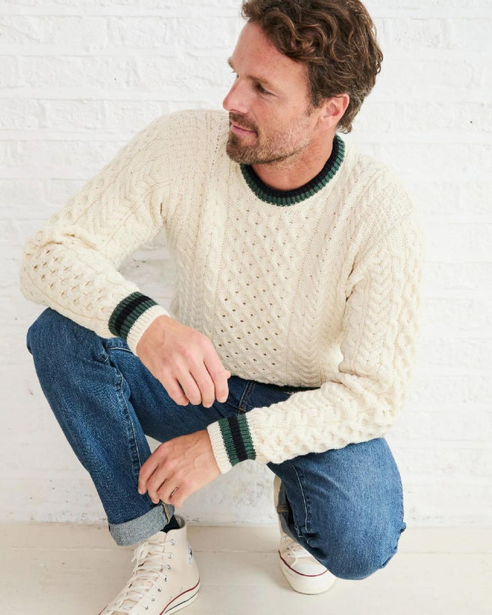 Cream Coloured Aran Mens Inishbeg Stripe Crewneck Merino Sweater on indoor background #colour_cream