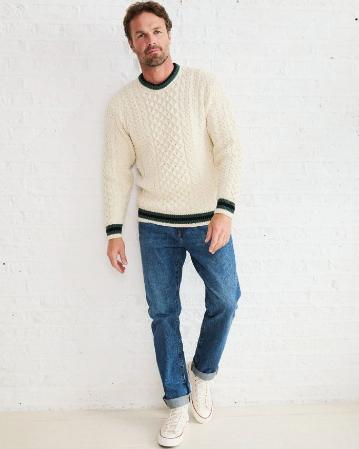 Cream Coloured Aran Mens Inishbeg Stripe Crewneck Merino Sweater on indoor background #colour_cream