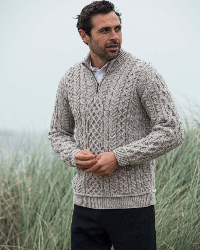 Oat Coloured Aran Supersoft Merino 1/2 Zip Jumper on grass background #colour_oat