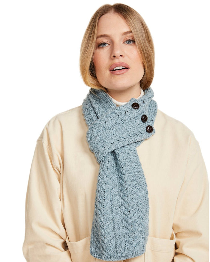 Blue Coloured Aran Womens Ballina Buttoned Loop Scarf on white background #colour_blue