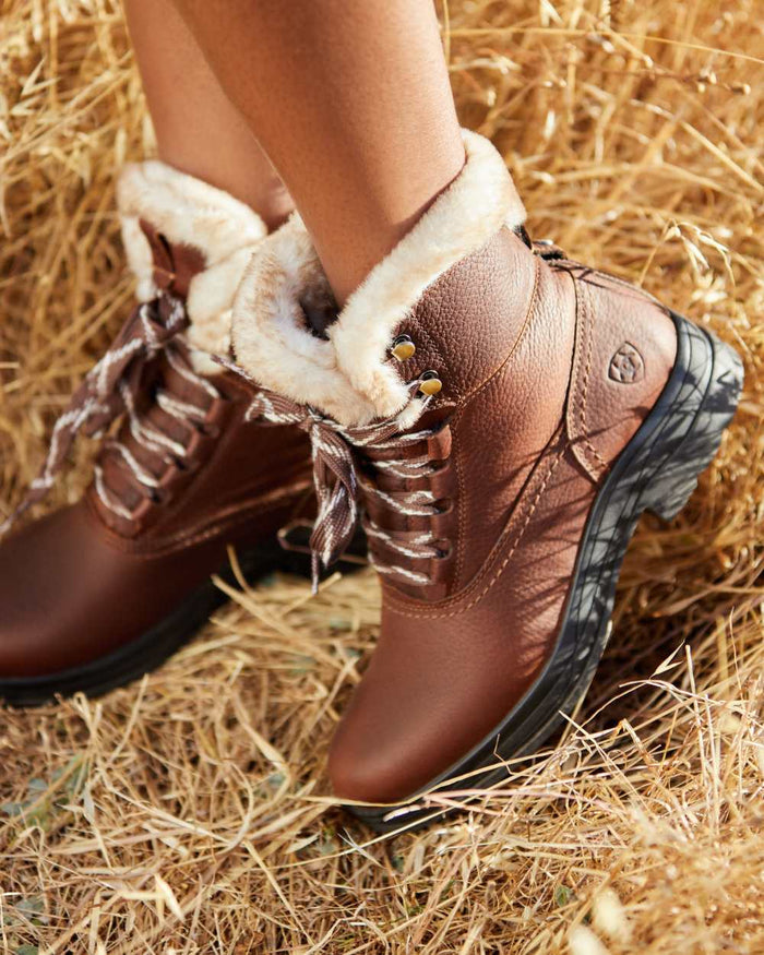 Dark Brown coloured Ariat Womens Harper Sherpa Waterproof Boots on hay background #colour_dark-brown
