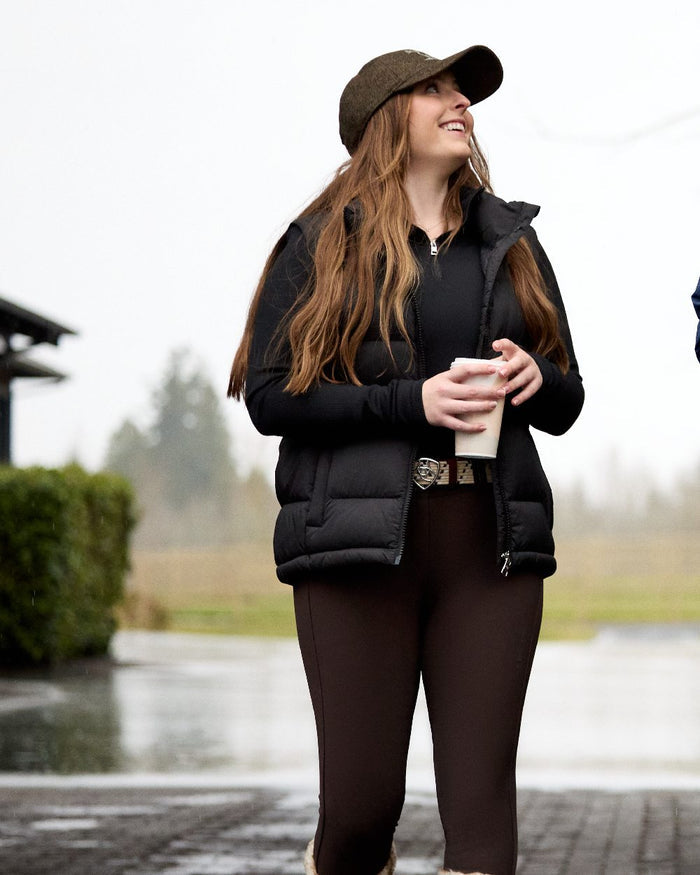 Black Coloured Ariat Womens Lucent Quarter Zip Baselayer on outdoor background #colour_black