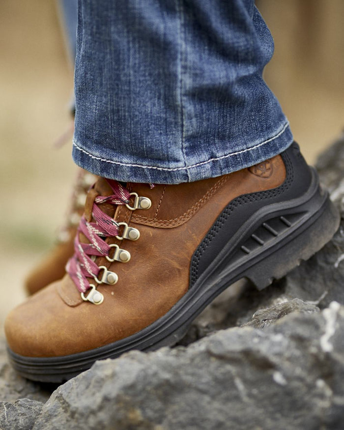 Rainstorm Coloured Ariat Womens Real Mid Rise Icon Stackable Straight Leg Jeans on blurry background #colour_rainstorm