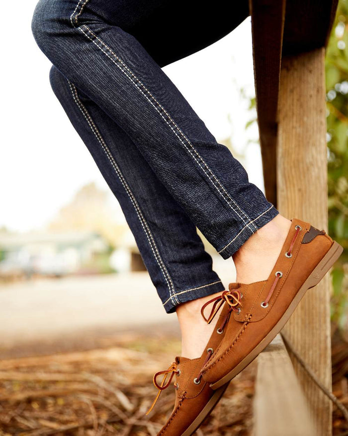 Celestial Coloured Ariat Womens Real Mid Rise Outseam Ella Skinny Jean on wooden fence background #colour_celestial
