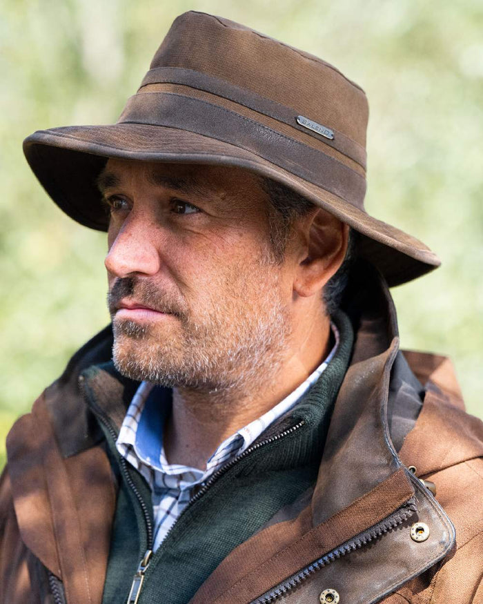 Earth Brown Coloured Baleno Edith Waterproof Hat on blurry background #colour_earth-brown