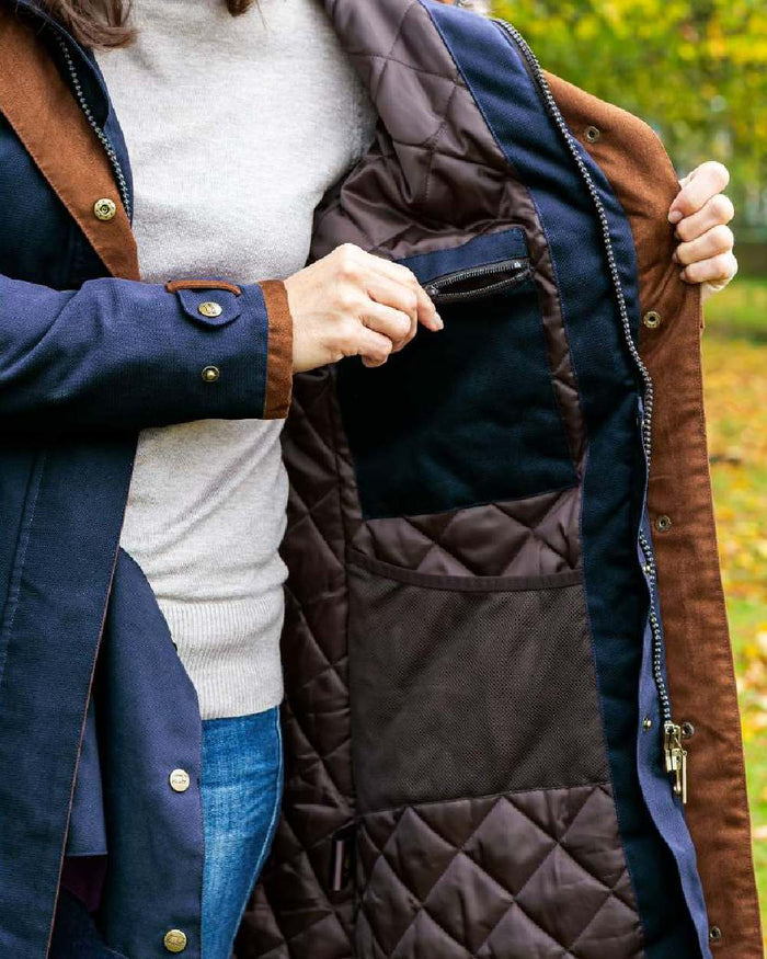 Dark Blue coloured Baleno Kensington Warm Long Waterproof Coat on blurry background #colour_dark-blue