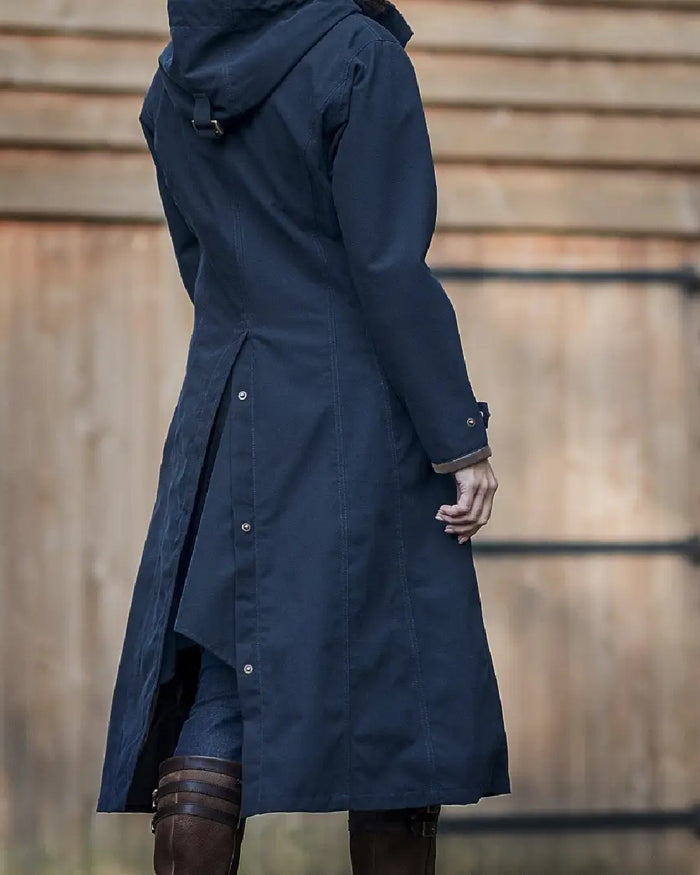 Dark Blue coloured Baleno Kensington Warm Long Waterproof Coat on blurry background #colour_dark-blue