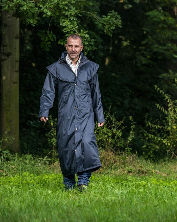 Navy Blue Coloured Baleno Newbury Waterproof Long Coat On A Forest Background #colour_navy-blue