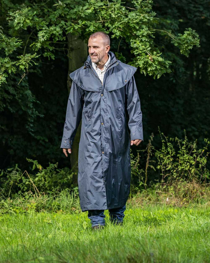 Navy Blue Coloured Baleno Newbury Waterproof Long Coat On A Forest Background #colour_navy-blue