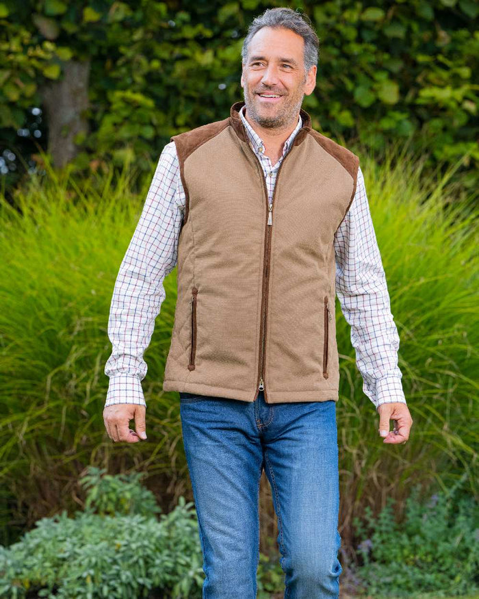 Camel Coloured Baleno Scott Quilted Mens Bodywarmer on countryside background #colour_camel