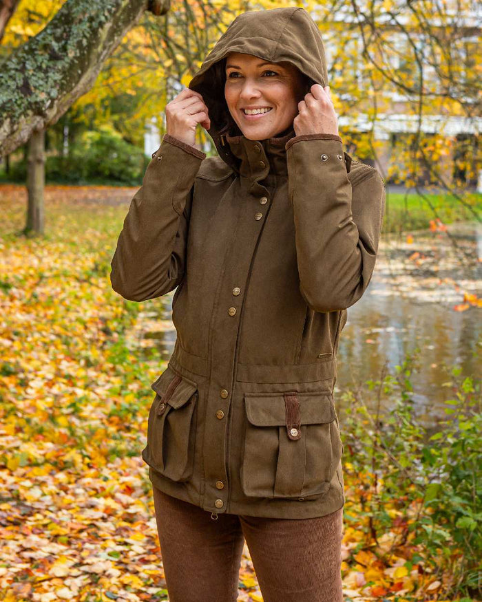 Pine Green Coloured Baleno Womens Ladywood Fashionable Country Jacket on countryside background #colour_pine-green