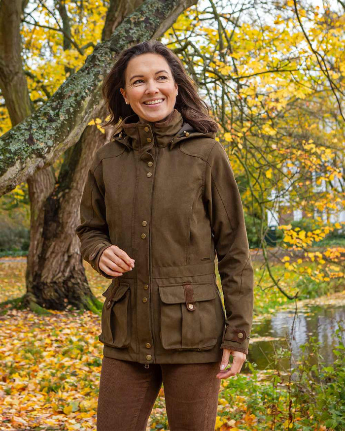 Pine Green Coloured Baleno Womens Ladywood Fashionable Country Jacket on countryside background #colour_pine-green