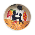 Hand-painted ceramic pet bowl featuring a black poodle design with beach motifs, created by Laguna Beach Artist Debby Carman