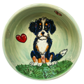 image of whimsical bernadoodle painted on ceramic pet bowl by debby carman