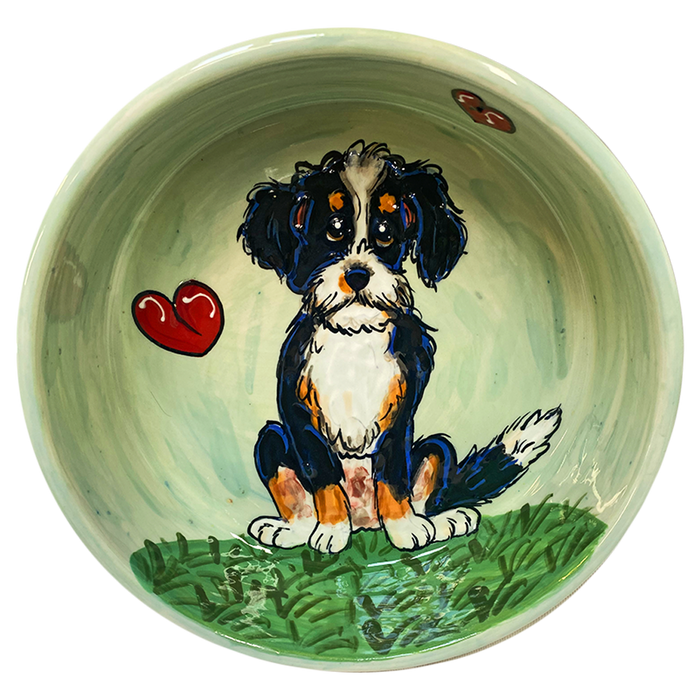 image of whimsical bernadoodle painted on ceramic pet bowl by debby carman