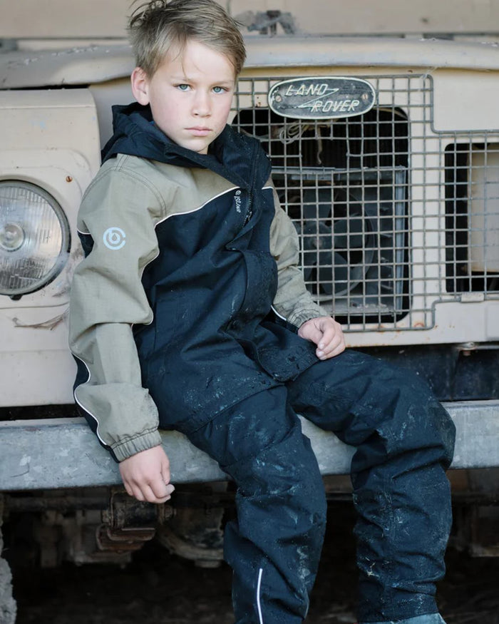 Black coloured Betacraft Childrens ISOJNR Bib Overtrousers on outdoor background #colour_black