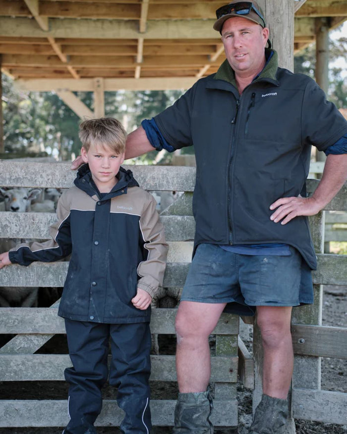 Black Mushroom coloured Betacraft Childrens ISOJNR Jacket on outdoor background #colour_black-mushroom