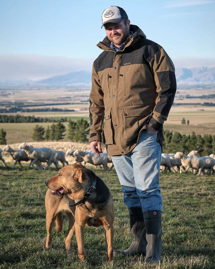 Taupe coloured Betacraft Mamaku Jacket on mountain background #colour_taupe