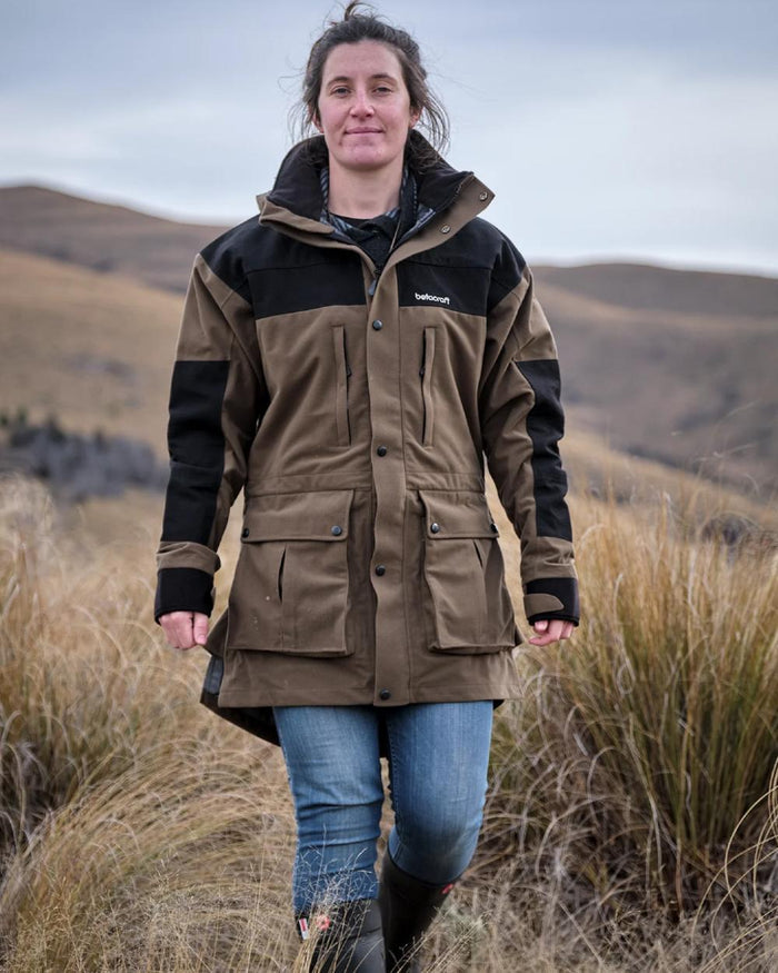 Taupe coloured Betacraft Mamaku Jacket on mountain background #colour_taupe