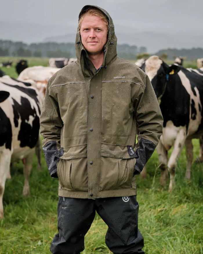 Dark Khaki coloured Betacraft Mens Rover Jacket on farm background #colour_dark-khaki