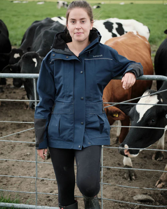 Dark Navy coloured Betacraft Womens Rover Jacket on farm background #colour_dark-navy