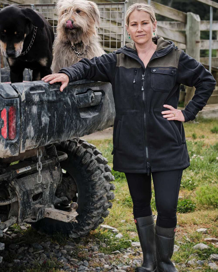 Black coloured Betacraft Womens Zephyr Fleece Jacket on outdoor background #colour_black