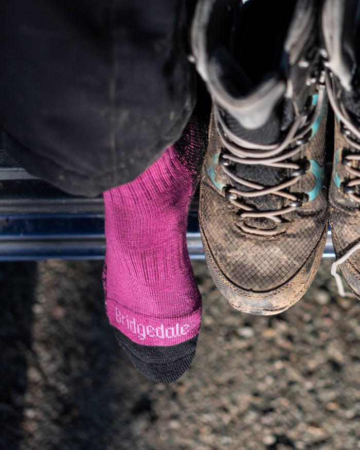 Berry Coloured Bridgedale Womens Lightweight Merino Performance Socks on Outdoor Background
#colour_berry