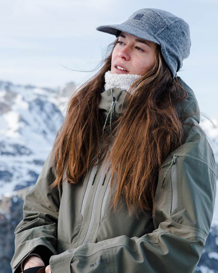 Grey Coloured Buff Pack Merino Fleece Cap on snow background #colour_grey