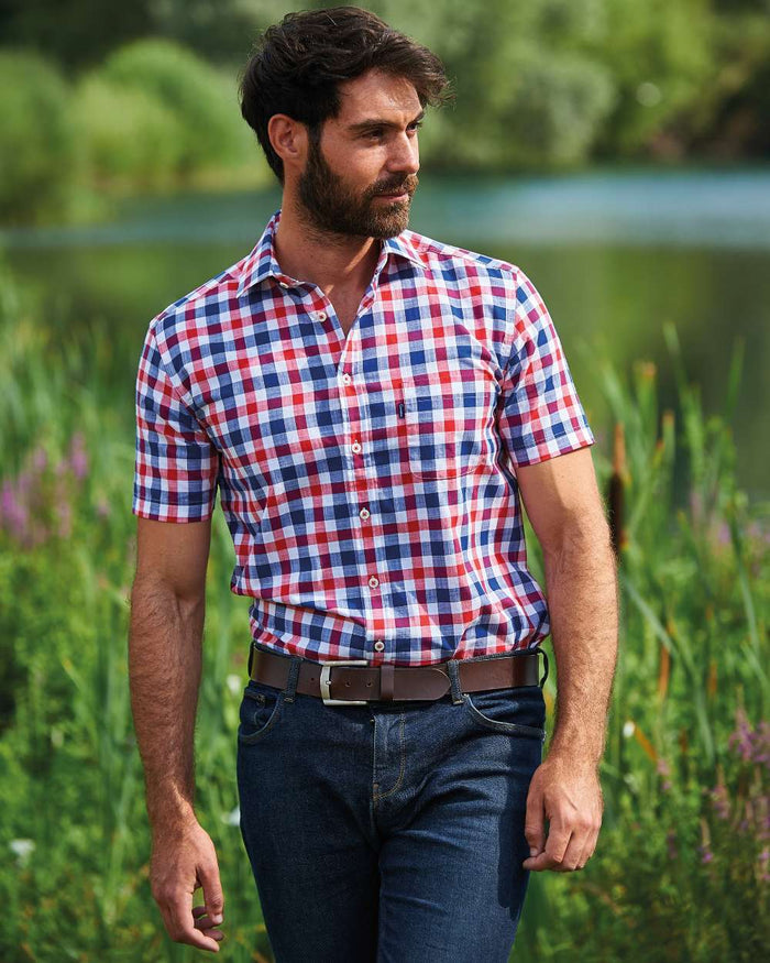 Red coloured Champion Holkham Short Sleeved Shirt on river background #colour_red