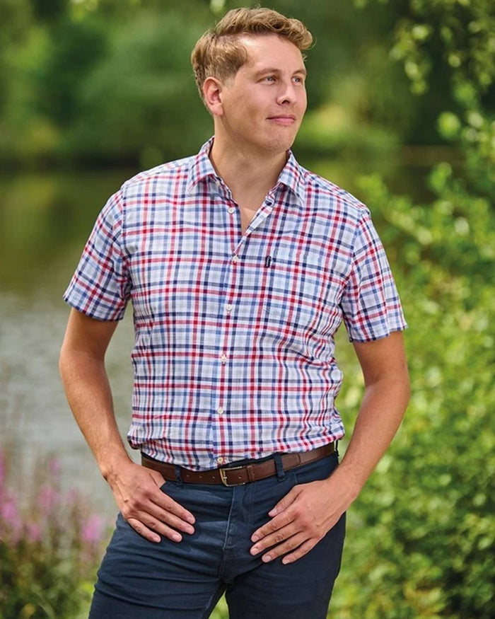 Red coloured Champion Mens Broadstairs Short Sleeve Shirt on lake background #colour_red
