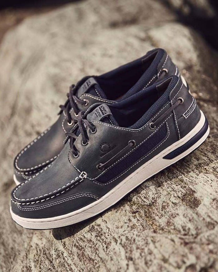 Navy coloured Chatham Mens Buton G2 Premium Leather Deck Shoes on rock background #colour_navy