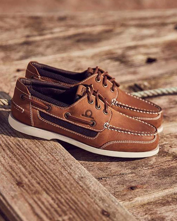 Walnut coloured Chatham Mens Buton G2 Premium Leather Deck Shoes on wooden deck background #colour_walnut