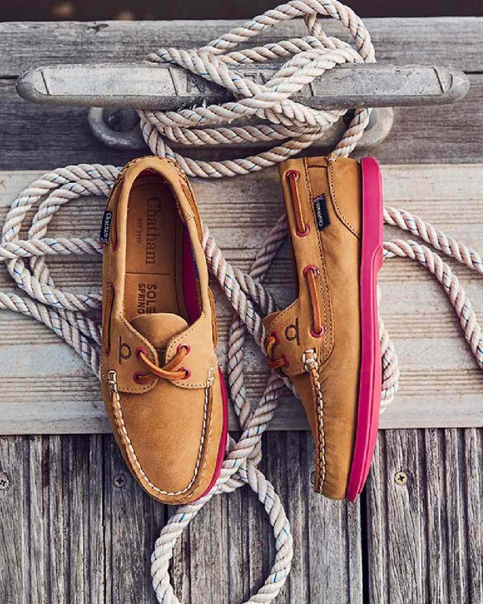 Tan Pink Coloured Chatham Womens Pippa II G2 Leather Boat Shoes on boat background #colour_tan-pink