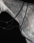 Black coloured Collegiate Running Martingale IV on black background #colour_black