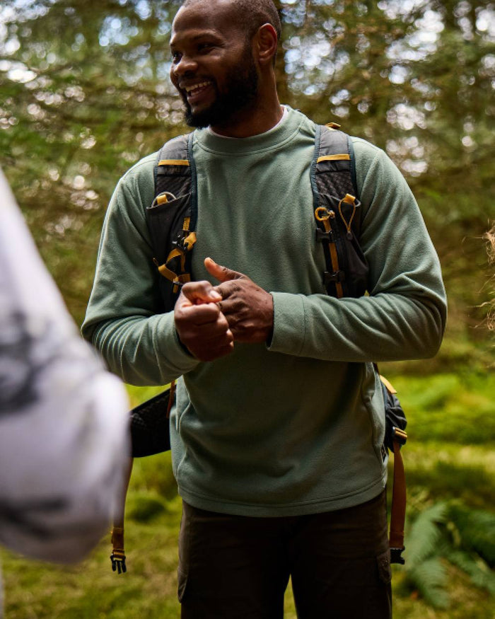 Laurel Green Coloured Craghoppers Mens Corey Crew Neck Sweaters on forest background #colour_laurel-green