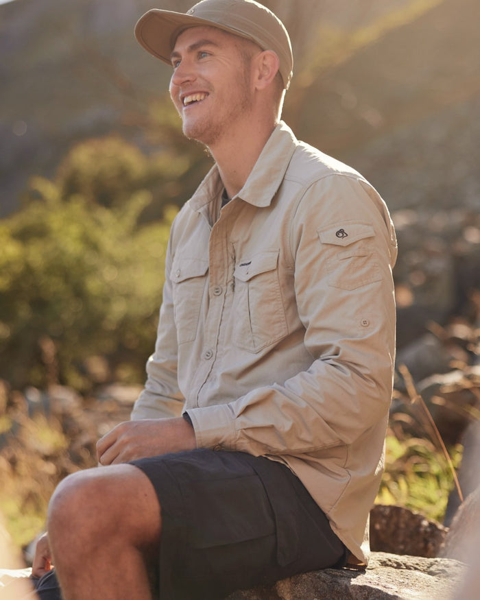 Parchment Craghoppers Mens NosiLife Adventure Long Sleeved Shirt III on forest background #colour_parchment