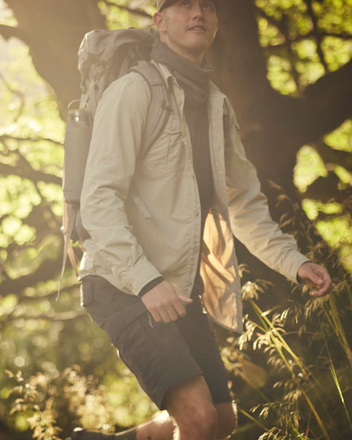 Parchment Craghoppers Mens NosiLife Adventure Long Sleeved Shirt III on forest background #colour_parchment