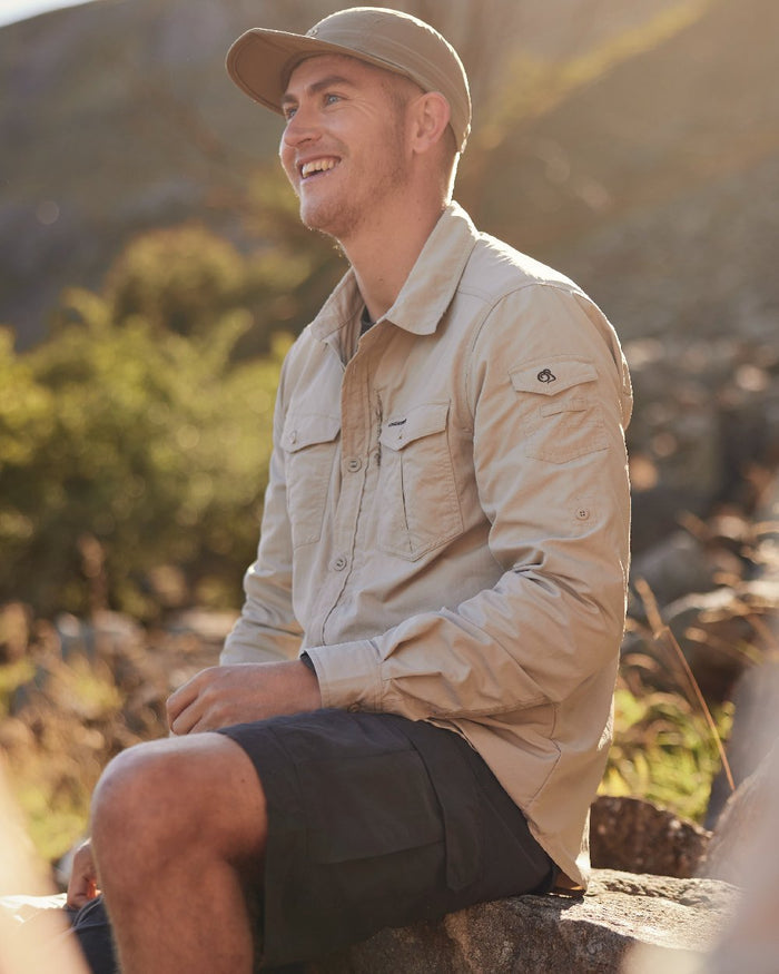 Black Pepper coloured Craghoppers Mens NosiLife Cargo Short III on blurry background #colour_black-pepper