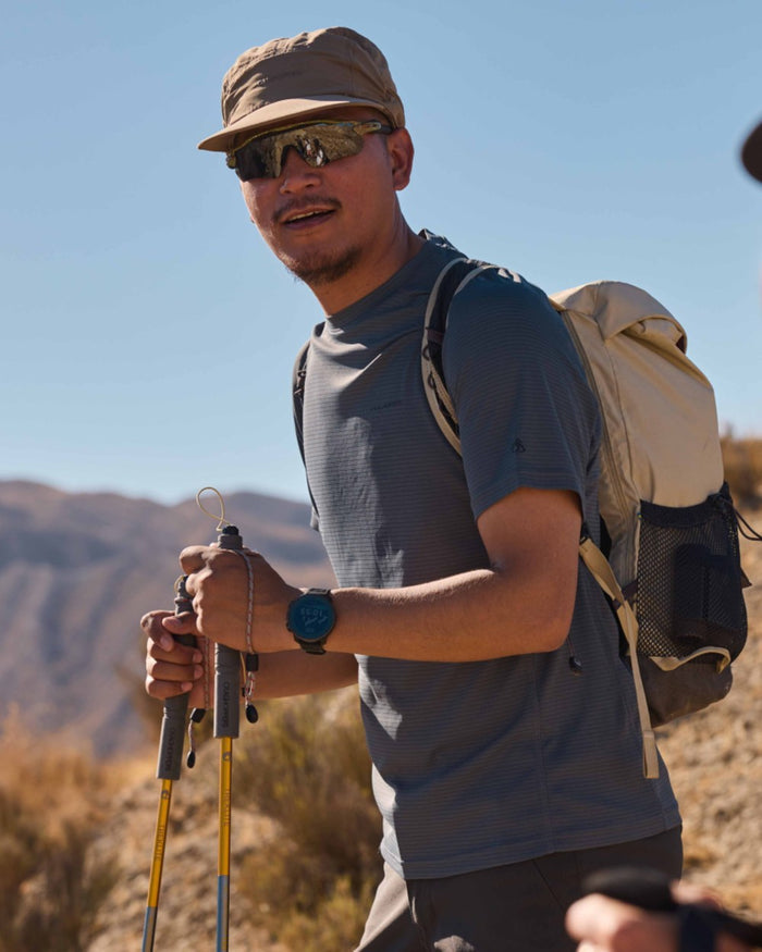 Dark Pewter coloured Craghoppers Mens NosiLife SolarShield+ Short Sleeved T-Shirt on mountain background #colour_dark-pewter