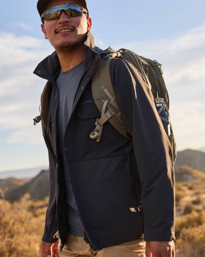 Dark Iron coloured Craghoppers Mens NosiLife Younes Jacket on mountain background #colour_dark-iron